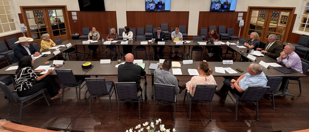 SAFE Task Force members meeting around tables in the district Central Office board room.