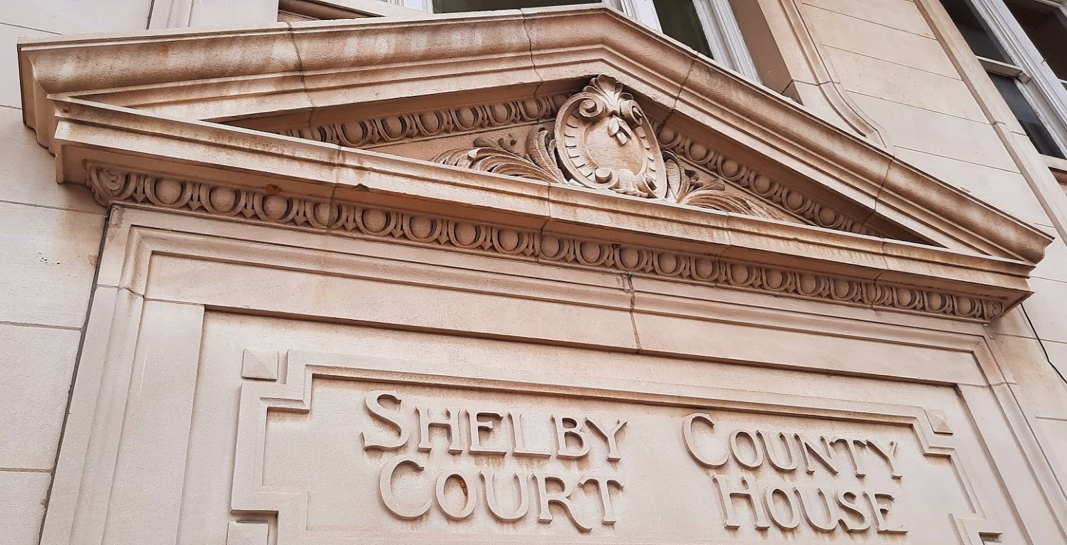 Carved stonework above an entrance to the Shelby County courthouse.